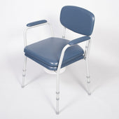 Blue NRS Dovedale Comfort Commode with padded backrest, armrests, adjustable legs and removable white bucket, front view.