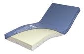 Alerta Sensaflex Bariatric 1200 wide mattress with memory foam, blue cover and adjustable head support, angled view.