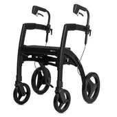 Black rollator with four large wheels, ergonomic handles and built-in seat, side view.