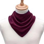Dark purple neckerchief style dribble bib on mannequin, front view.