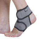 Kedley Pro-Light Neoprene Ankle Support worn on left foot, white background, in use view.