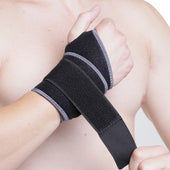 Kedley Aero-Tech Neoprene Advanced Wrist Support being fastened on a person’s wrist, shows fit and support, in use close-up.