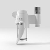 White shower filter with clear chamber and silver cap, shown with bubble showerhead set, front angle.