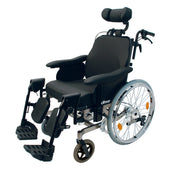 Drive Multitec self-propel wheelchair with padded seat, headrest, adjustable leg rests and large rear wheels, side view.