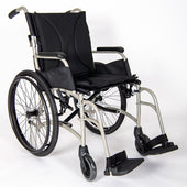 Black and silver self-propelled lightweight wheelchair with large rear wheels and footrests, white background, side view.