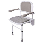 Folding shower seat with legs, padded seat, back and armrests for support, side view.