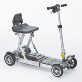 Grey four-wheel folding scooter with backrest seat and handlebars, compact design shown folded, side view.