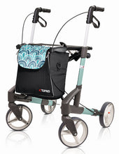 Red Topro Troja Original rollator with large wheels and a patterned front storage bag, side view.