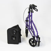 Orange three wheel aluminium rollator with separate black storage bag, white background, side view.