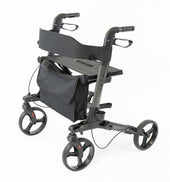 Black aluminium rollator with four wheels, hand brakes, seat and pouch shown folded, side view.