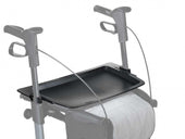 Topro Tray attached to walker handles over the seat, shown in use, side view.