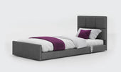 Anthracite profiling floor bed with white bedding and purple accents, plain background, front view.