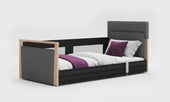 Solo SafeSide anthracite floor bed with grey upholstery and black safety rail, side view.