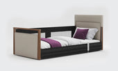 Opera Beds Solo SafeSide Profiling Floor Bed with anthracite upholstery and side rails, front angle view.