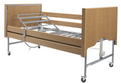Drive Casa Elite Home Care Bed in light oak with metal rails, wheels, and electric controls for adjustability, side view.