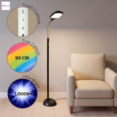 Black Lifemax professional reading floor light with touch controls, 95 CRI, 1,000 lumens next to a beige armchair, side view.