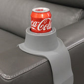 Black CouchCoaster Anti-Spill Drink Holder with red Coca-Cola can on grey sofa armrest, in use view.