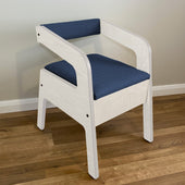 Blue Timberry Scandi commode with wooden legs on a light wood floor against a pale wall, front view.