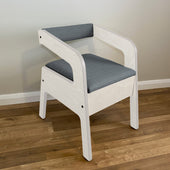 Grey Gordon Ellis Timberry Scandi Commode on a wooden floor against a plain wall, front view.