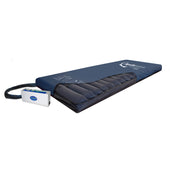 Apollo 5 Premium Dynamic Overlay Mattress System for pressure relief, shown on bed base, angled side view.