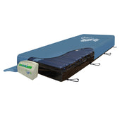 Apollo Pro Plus bariatric dynamic mattress system with blue cover, visible air tubes and attached control unit, angled side view.