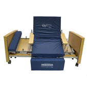Apollo Saturn Rotate Bed with blue padding, upright backrest, and wooden sides for support, side view.