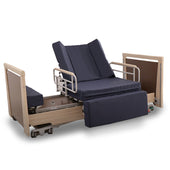 Apollo Saturn Rotate Low Bed with wooden panels, blue cushions, adjustable rails and pressure-relief mattress, side view.