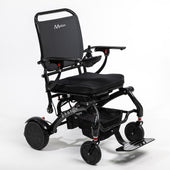 Motion Healthcare Photon Lite carbon fibre folding powerchair with armrests, cushioned seat, footrest and joystick control, side view.