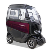 Three-wheeled enclosed mobility scooter in black and maroon, front angle view.