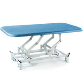 SEERS Medical electric therapy mat table with padded top, adjustable height, white metal frame and wheeled legs, side view.