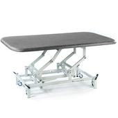 SEERS Medical Electric Therapy Mat Table with height-adjustable padded surface and wheeled frame, side view.