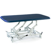 SEERS Medical Hydraulic Therapy Mat Table with cushioned top, height-adjustable frame on wheels, side view.
