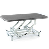 Dark grey hydraulic therapy mat table with white wheeled frame and height adjustment, side view.