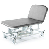 SEERS Medical Electric Therapy Bobath Couch with padded adjustable surface and wheeled metal frame, side view.