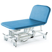 Blue padded hydraulic therapy Bobath couch with white frame and wheels, used for physiotherapy or rehab, side view.