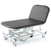SEERS Medical Hydraulic Therapy Bobath Couch with raised backrest and wheeled metal frame, side view.