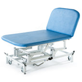 SEERS Medical hydraulic therapy Bobath couch with white frame and wheels, side view.