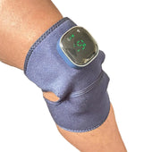 Lifemax 3 in 1 Heated Vibration Massager strapped to forearm for joint pain relief, close-up in use view.