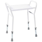 White shower stool with side handles and four rubber-tipped legs for stable bathroom seating, front angle view.