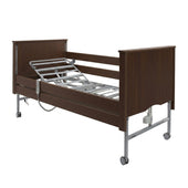 Sidhil Bradshaw Nursing Care Bed with adjustable frame, side rails and wheels, front view.