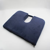 Drive Coccyx Cushion, wedge shape with handle for pressure relief, shown against a white background, angled front view.