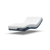 Adjustable mattress with memory foam, textured surface and raised head and foot, shown on a plain background, front angle.