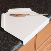 Gordon Ellis Derby Preparation Board on a granite kitchen counter, wood cabinets below, angled view.