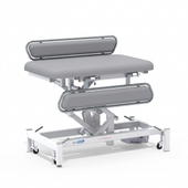 Medi-Plinth electric changing table with padded surface, side rails and caster wheels, NHS-approved, MRSA-resistant, side view.