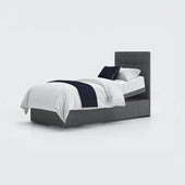 Opera Beds Emerald Motion Adjustable Divan Bed with white bedding, navy throw and pillow on plain white background, front view.