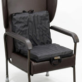 Harley 2-Way Sculptured Support Cushion on a brown chair seat and backrest, front view.