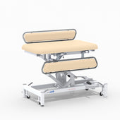 Medi-Plinth hydraulic changing table with MRSA-resistant upholstery, silver rails and white wheeled frame, side view.