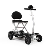 Drive Instafold folding mobility scooter with four wheels, cushioned seat and automatic folding, side view.