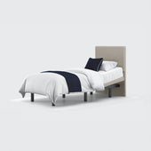 Opera Beds Jade Motion Adjustable Bed with headboard, white bedding, dark blue throw and pillow, front view.