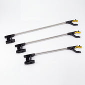 Three Homecraft Lightweight Handi Reacher tools with metal shafts and plastic gripper heads, angled view.
